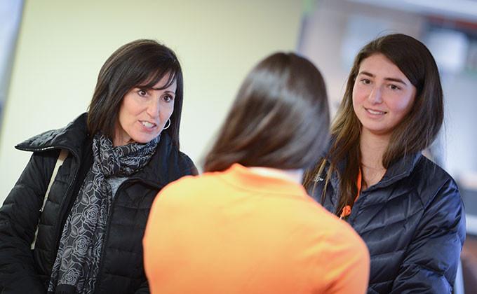 Student and Parent speaking with admission counselor